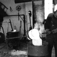 John Miecznikowski and Wallace casting molten bronze